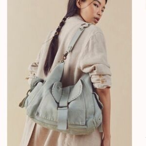 Free People We The Free Leigh Distressed bag aqua haze NWT +brass lock key chain